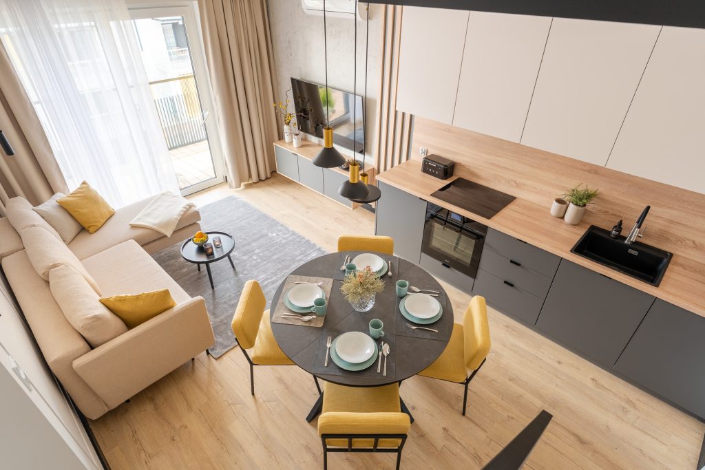 Bright living room with yellow chairs – apartment in Grzybowo
