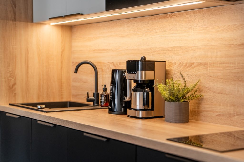 Fully equipped kitchen with a coffee machine